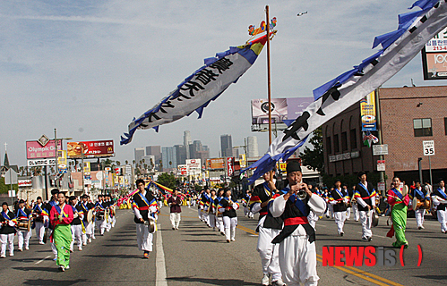 Traditional Korean percussion and dance groups march in the 39th Los Angeles Korean Festival parade