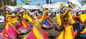 Kim Eung Hwa Korean Dance Company performs fan dance in the 2026 Kingdom Day Parade